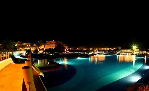 a luxury all inclusive beach resort at night in Cancun Mexico