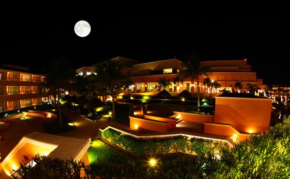 a luxury all inclusive beach resort at night in Cancun Mexico