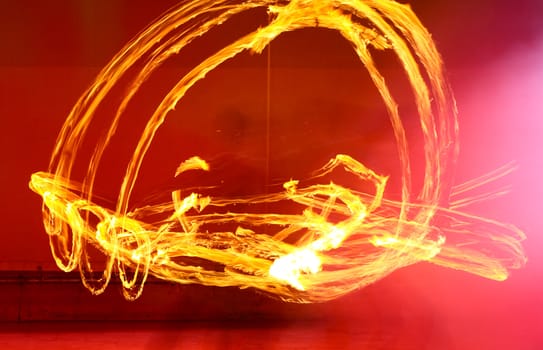 A fire show performed on stage in a beach resort