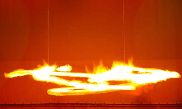 A fire show performed on stage in a beach resort