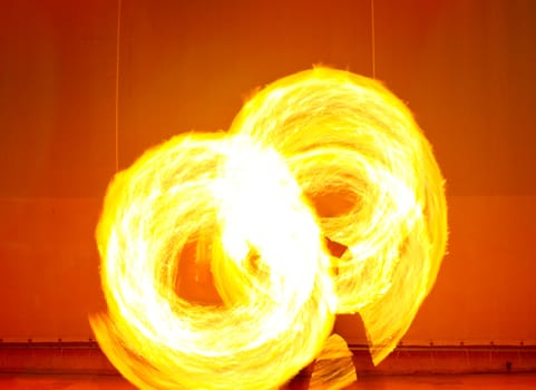 A fire show performed on stage in a beach resort