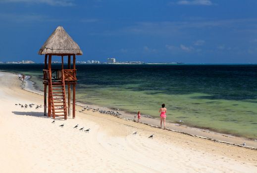 The beach front at a luxury beach resort in Cancun Mexico