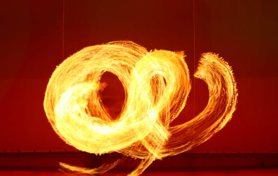 A fire show performed on stage in a beach resort