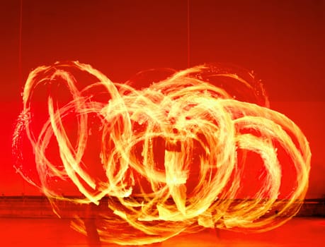 A fire show performed on stage in a beach resort