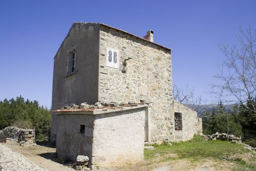 An old abandoned stone house in rural Sardinia. Horizontal,