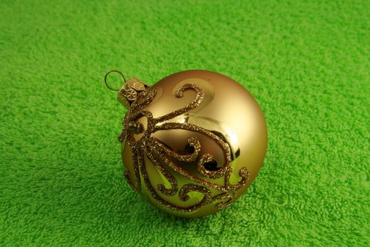 golden ball on soft green background