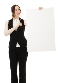 Young business woman wearing a business suit pointing up and holding a white board against white background
