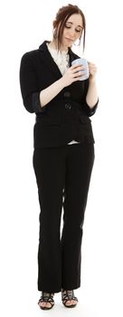 Young business woman looking into a coffee cup against white background