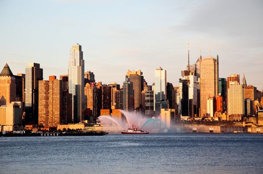 NEW YORK CITY - JULY 4, 2009: Fireboat waterjet show prior to the largest firework in the America - Macy's 4th of July fireworks which featured more than 40,000 shells.