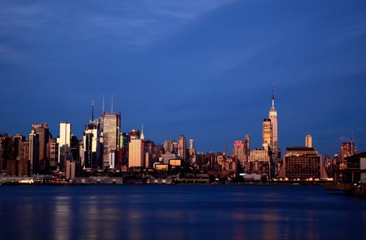 NEW YORK CITY - JULY 4, 2009: The Empire State Building lighting up red, white, and blue to observe the Independent Day.