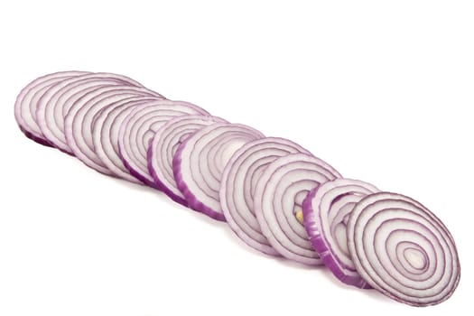 A long line of some sliced red onions
