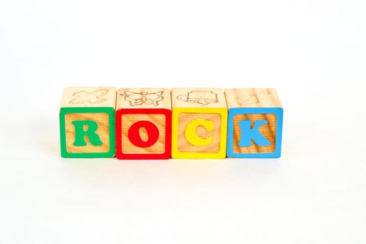 Vintage alphabet blocks spelling out ROCK