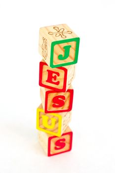 Vintage alphabet blocks spelling out JESUS