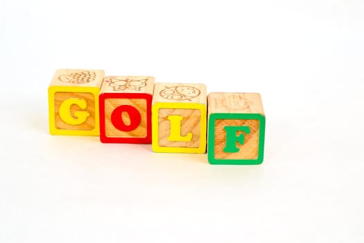 Vintage alphabet blocks spelling out GOLF