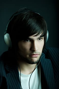 Young Man listening to music with headphones