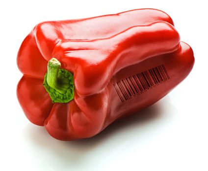 A whole red capsicum. Isolated on white. A generic (not real) barcode printed on the capsicum.