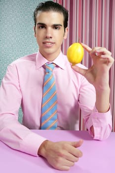 Funny businessman with lemon fruit on his hand in wallpaper background