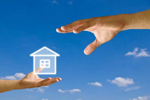 Small hand give the house icon to big hand with blue sky background