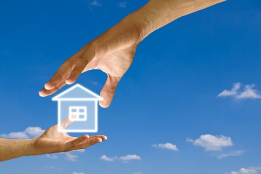 Big hand give the house icon to small hand with blue sky background, Concept