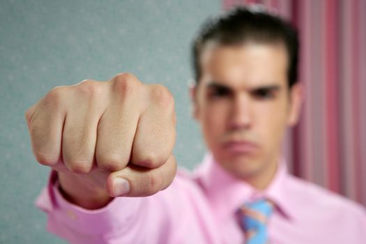 angry aggresive businessman with fist closeup to camera