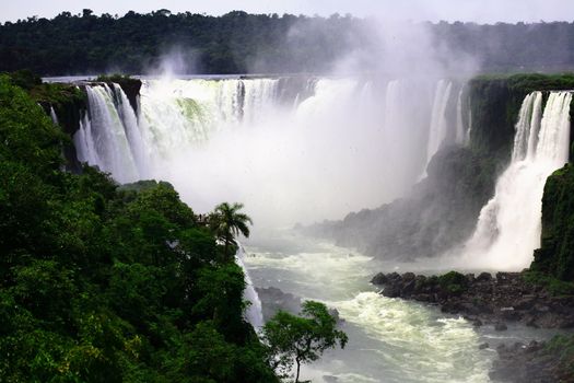 The Iguassu (or Iguazu) Falls is one of the largest masses of fresh water on the planet and divides, in South America, Brazil, Paraguay and Argentina. The waterfall system consists of 275 falls along 2.7 kilometres (1.67 miles) of the Iguazu River. Some of the individual falls are up to 82 metres (269 feet) in height, though the majority are about 64 metres (210 feet).