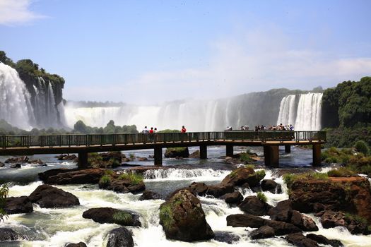 The Iguassu (or Iguazu) Falls is one of the largest masses of fresh water on the planet and divides, in South America, Brazil, Paraguay and Argentina. The waterfall system consists of 275 falls along 2.7 kilometres (1.67 miles) of the Iguazu River. Some of the individual falls are up to 82 metres (269 feet) in height, though the majority are about 64 metres (210 feet).