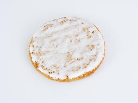 An close-up of an iced oatmeal cookie.