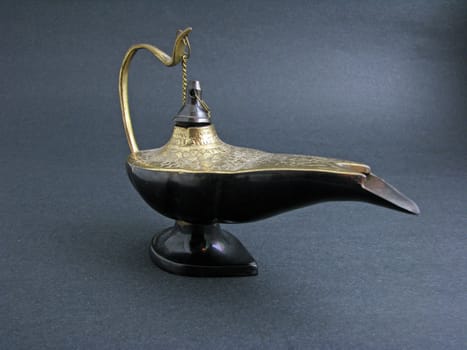 An India Aladdin's Lamp on a dark background.