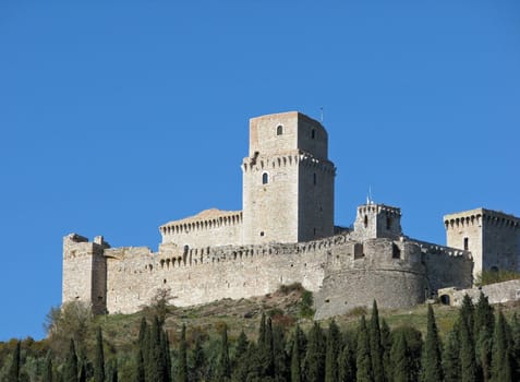 An ancient castle on a hillside in Assisi, Italy.