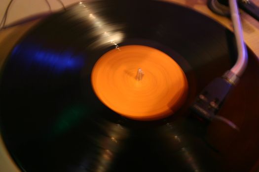 Vinyl disc spinning on a turntable, great for a vintage look
