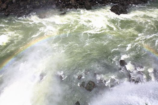 The Iguassu (or Iguazu) Falls is one of the largest masses of fresh water on the planet and divides, in South America, Brazil, Paraguay and Argentina. The waterfall system consists of 275 falls along 2.7 kilometres (1.67 miles) of the Iguazu River. Some of the individual falls are up to 82 metres (269 feet) in height, though the majority are about 64 metres (210 feet).