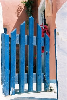 Blue gates on Santorini (Thira) island, Greece