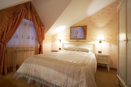 Bedroom with a mirror on a wall in hotel