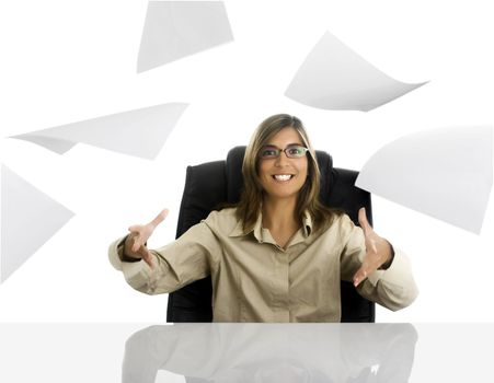 Business woman surprised and papers flying in the office