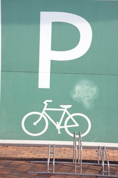 Bike parking place and sign near shopping center