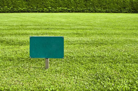 Green Keep of the grass blank sign in a meadow