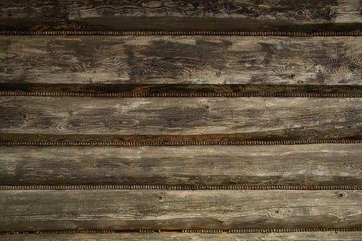 Close-up of beams from old mountain cabin wall