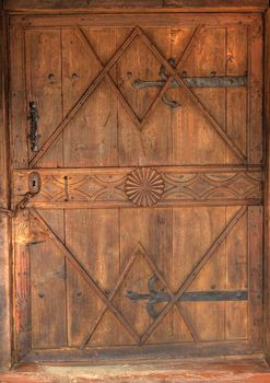 Close-up of hundreds years old wooden doors