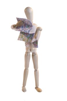 wooden artists dummy in pose as if reading map