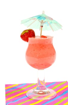 glass of strawberry smoothie  with small parasol isolated on white