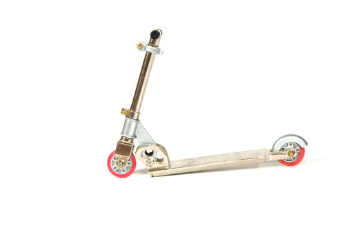iron scooter with pink wheels isolated on a white background