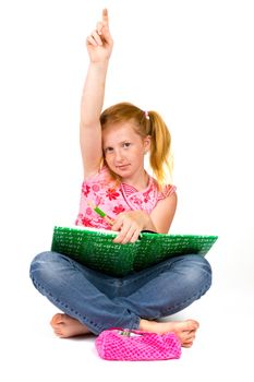 Little schoolgirl raised her hand to answer question isolated on white