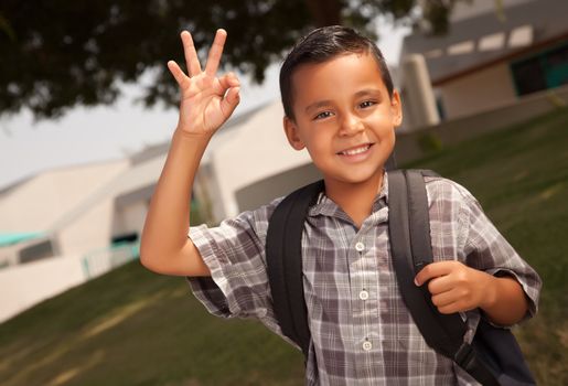 Happy Young Hispanic Boy with Backpack Ready for School.