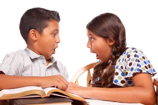 Hispanic Brother and Sister Having Fun Studying Together Isolated on a White Background.
