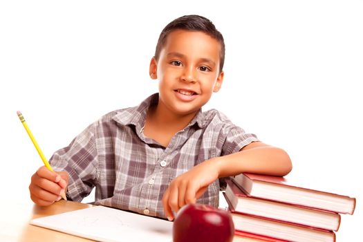 Adorable Hispanic Boy with Books, Apple, Pencil and Paper Isolated on a White Background.