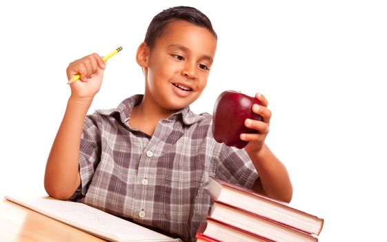 Adorable Hispanic Boy with Books, Apple, Pencil and Paper Isolated on a White Background.