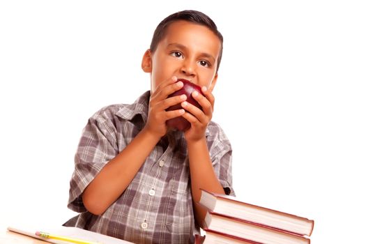 Adorable Hispanic Boy Eating a Large Red Apple Isolated on a White Background.