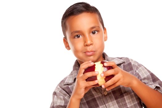 Adorable Hispanic Boy Eating a Large Red Apple Isolated on a White Background.