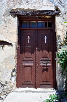 Travel photography: old door at the historic Preveli Monastery in Crete, 

Greece.