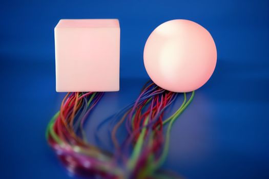 Glowing sphere and square with colorful wires, wired communication metaphor